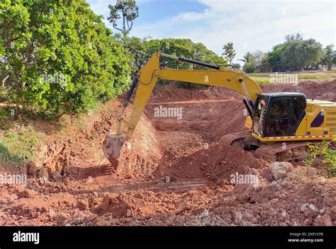 digging a pond with backhoe